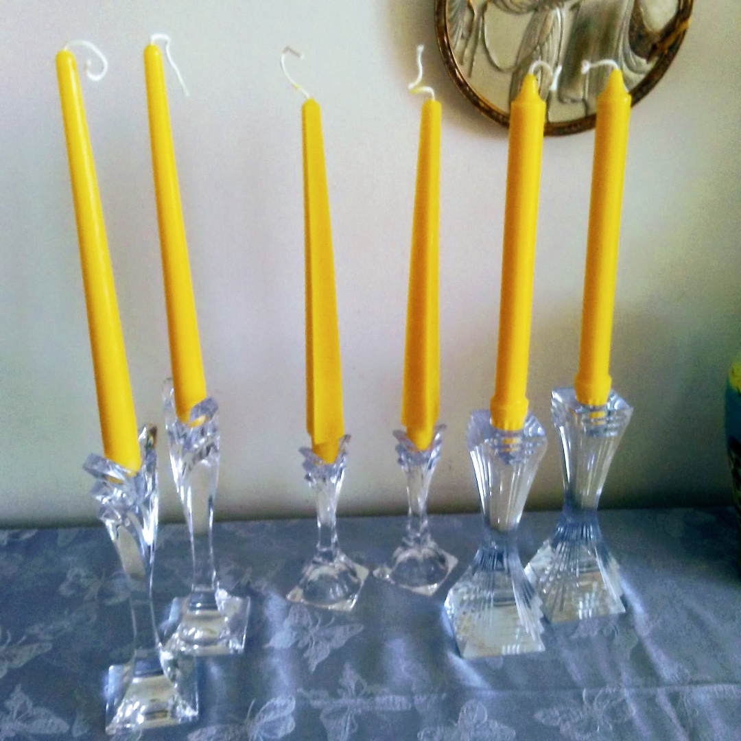 Beeswax tapered candles in crystal holders